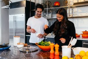 man and woman cooking