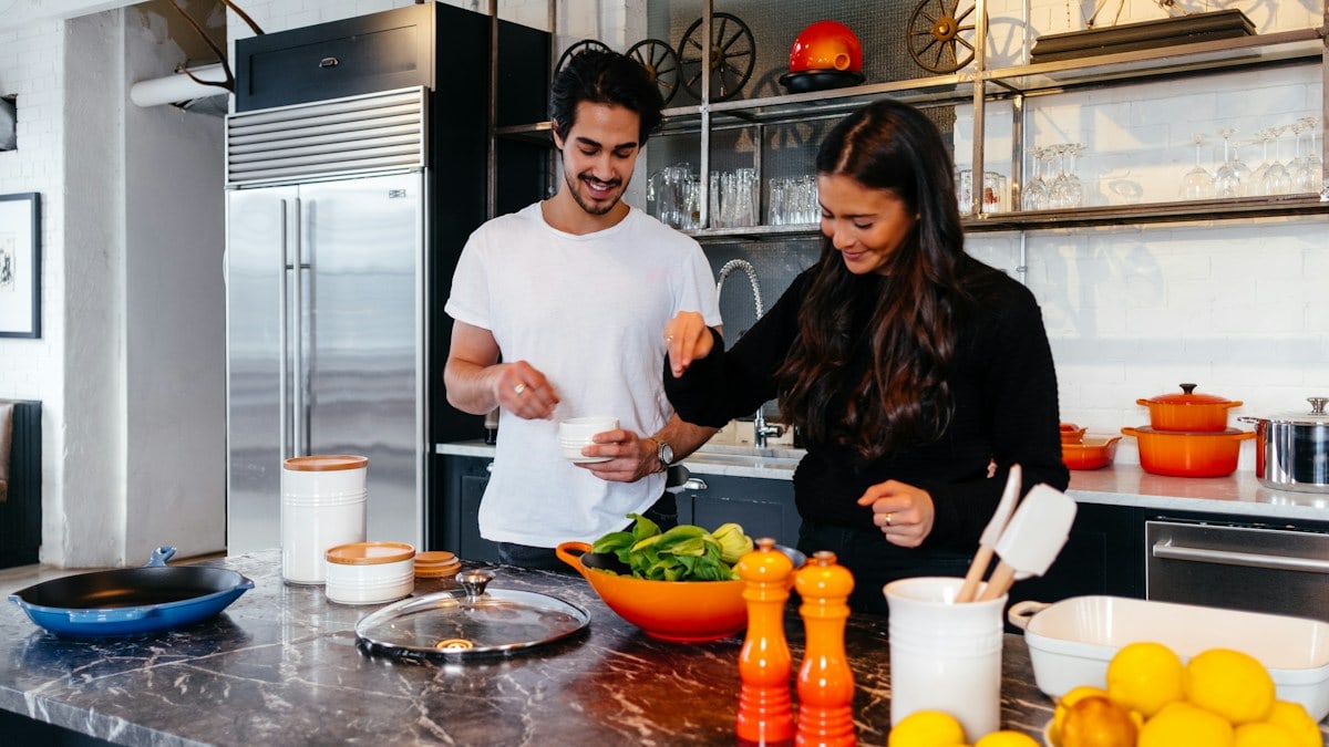 man and woman cooking